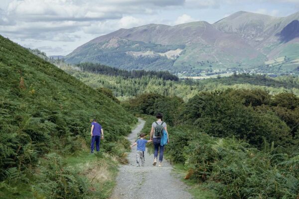 Family on a walk down a path in the Lake District